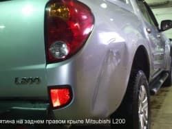 Вмятина на заднем правом крыле Mitsubishi L200